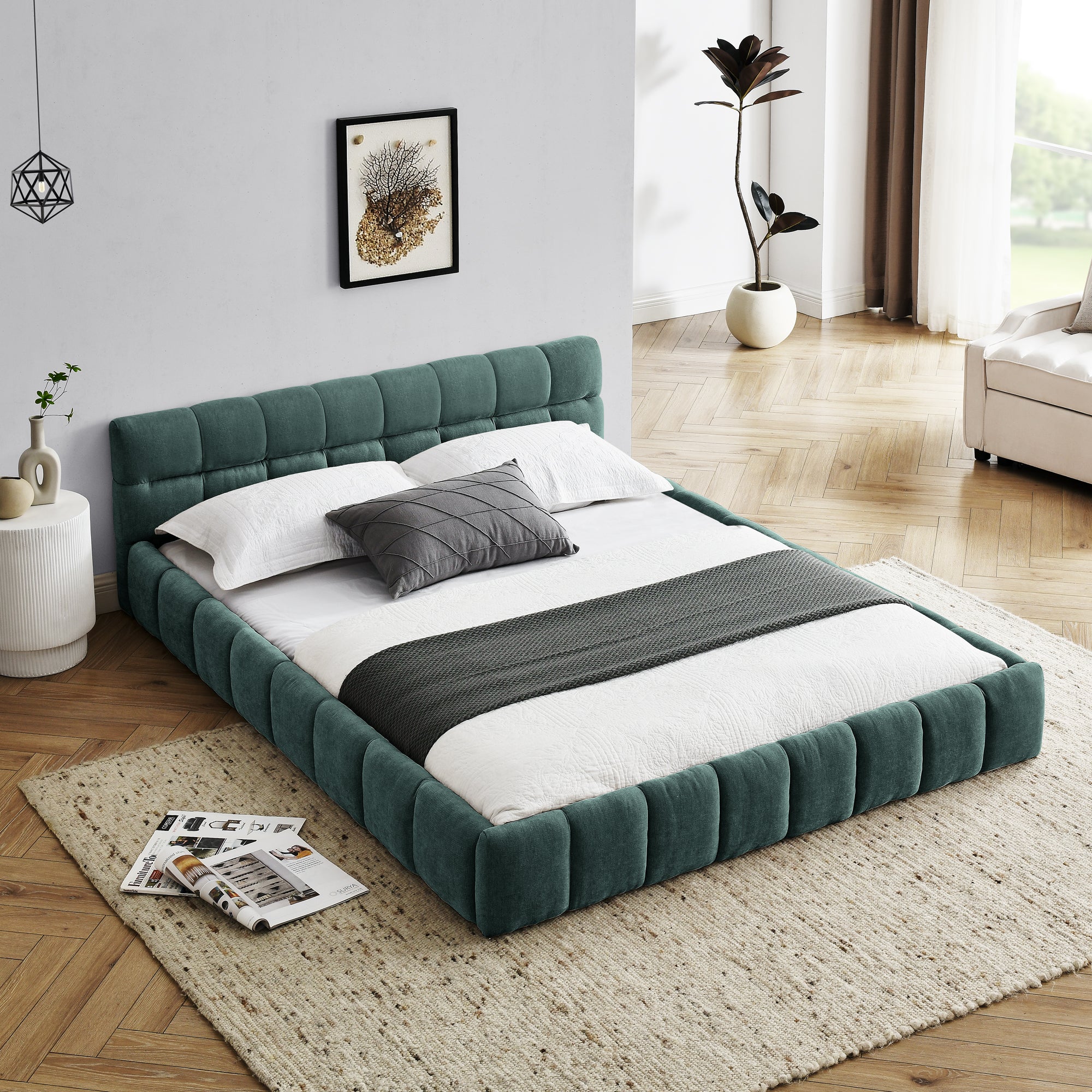 Large soft-padded bed frame in blue-green color