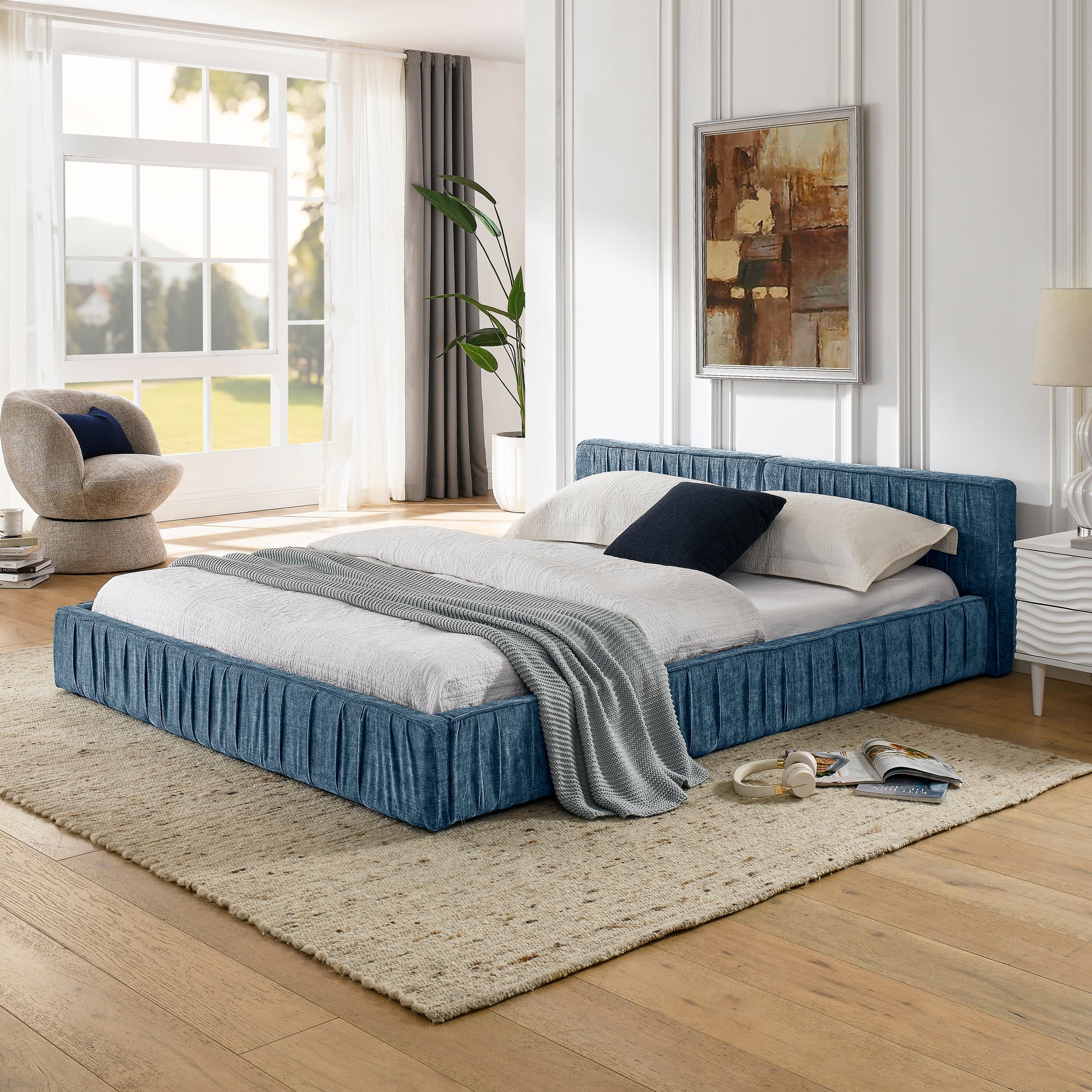 Large blue soft-padded bed frame