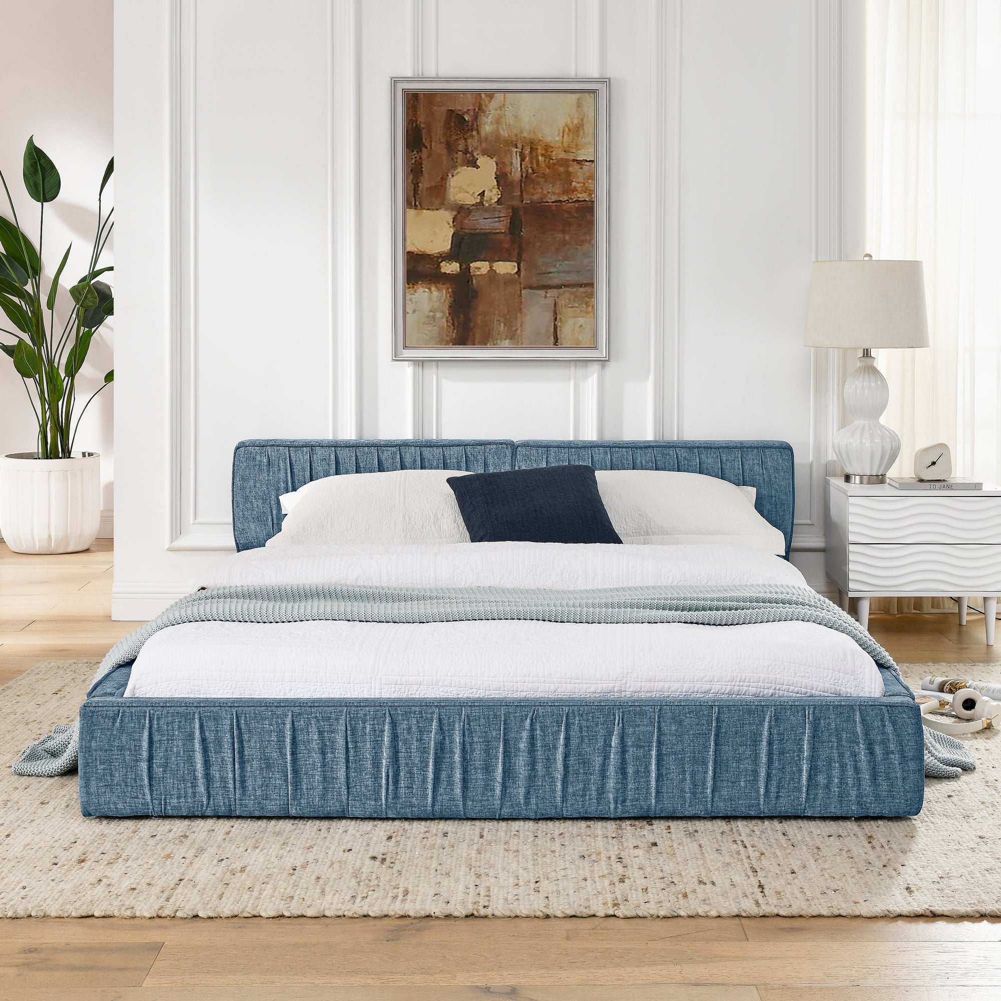 Large blue soft-padded bed frame