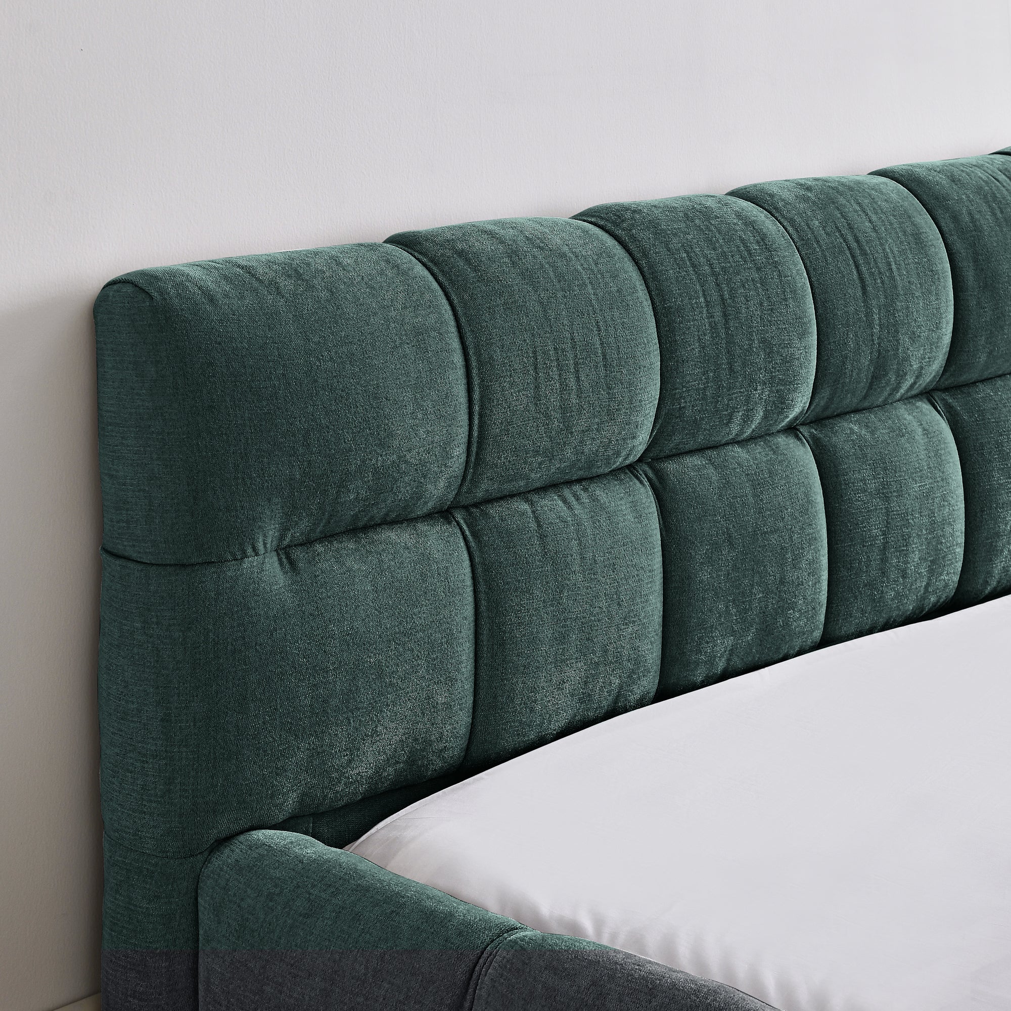 Large soft-padded bed frame in blue-green color