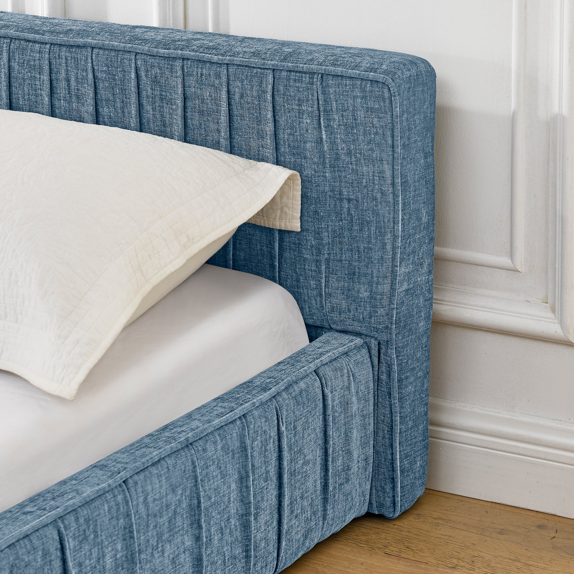 Large blue soft-padded bed frame