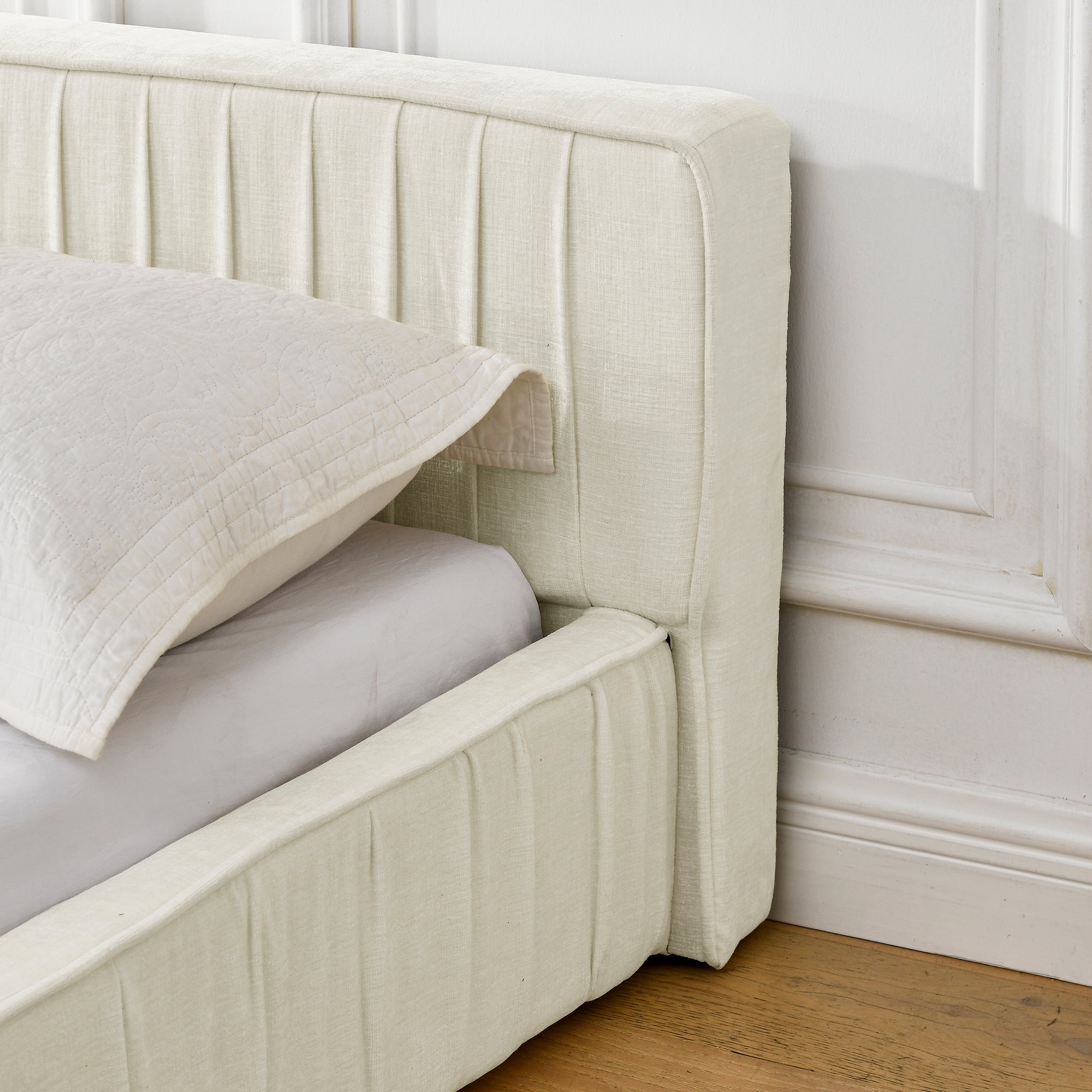 Beige large soft-padded platform bed frame