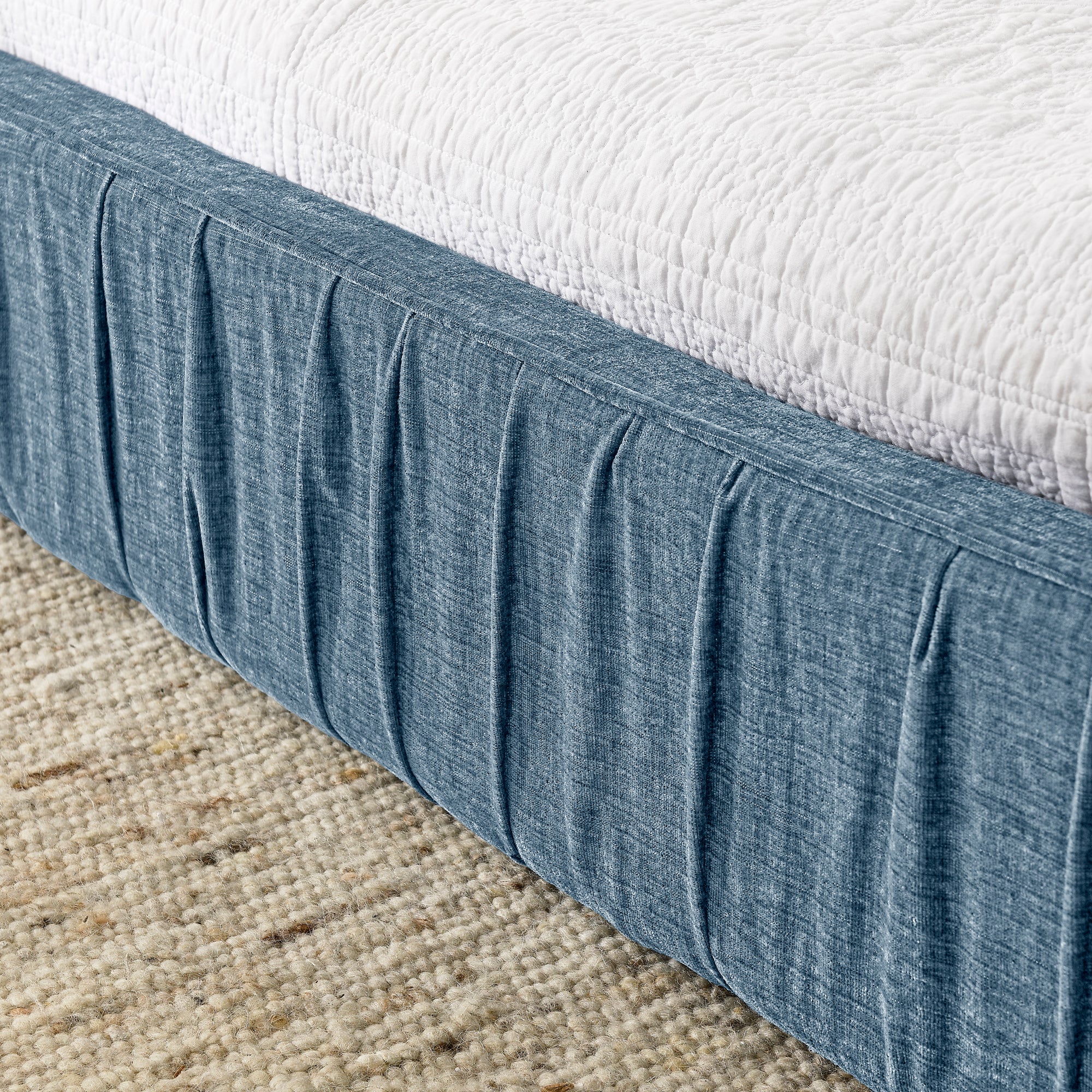 Large blue soft-padded bed frame