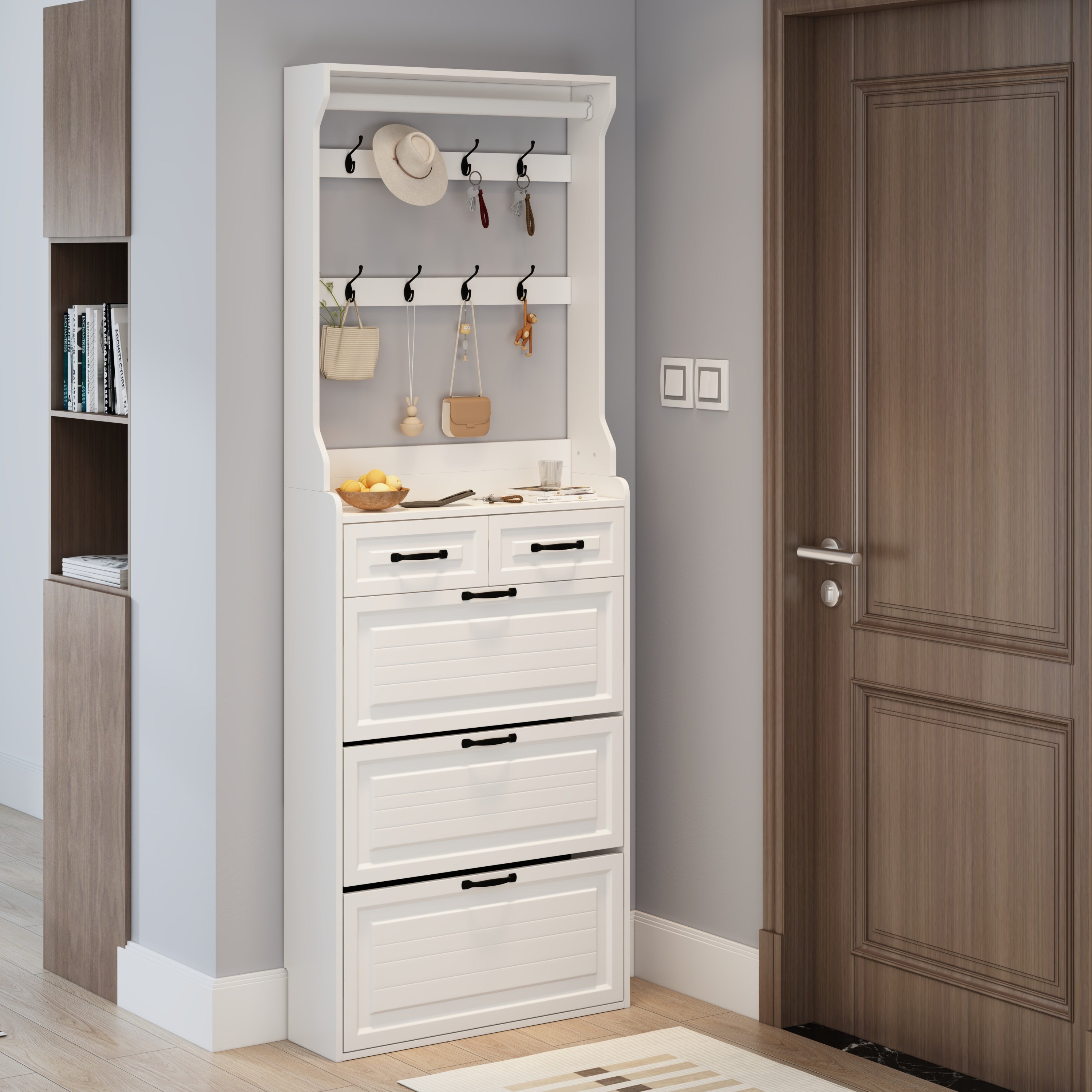 The white shoe cabinet has three doors and two drawers with clothes hangers