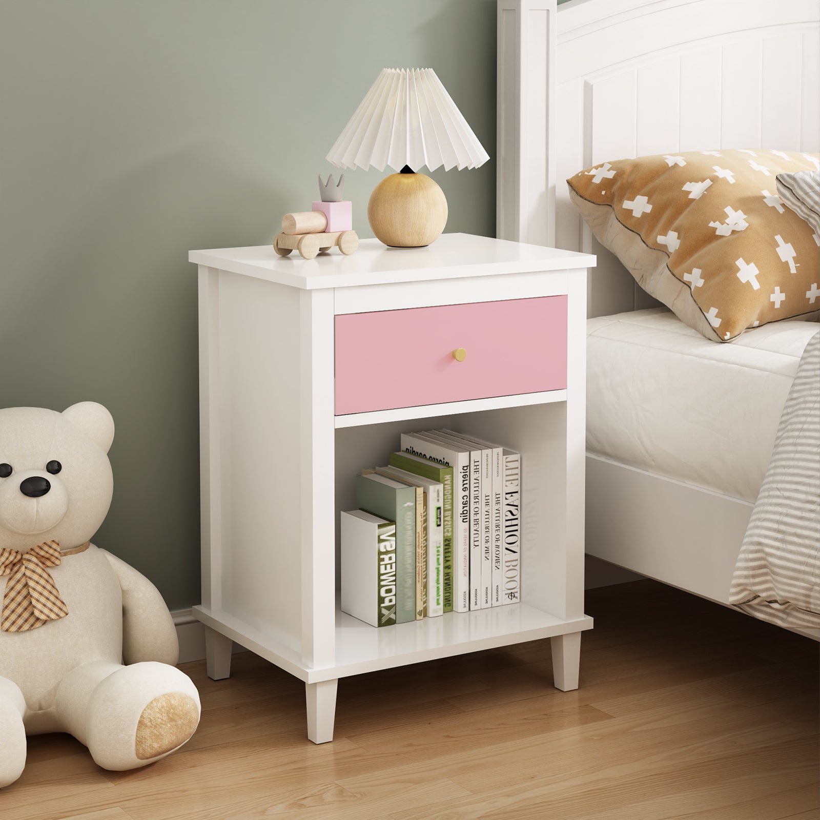 Pink wooden bedside table with drawers and storage cabinets