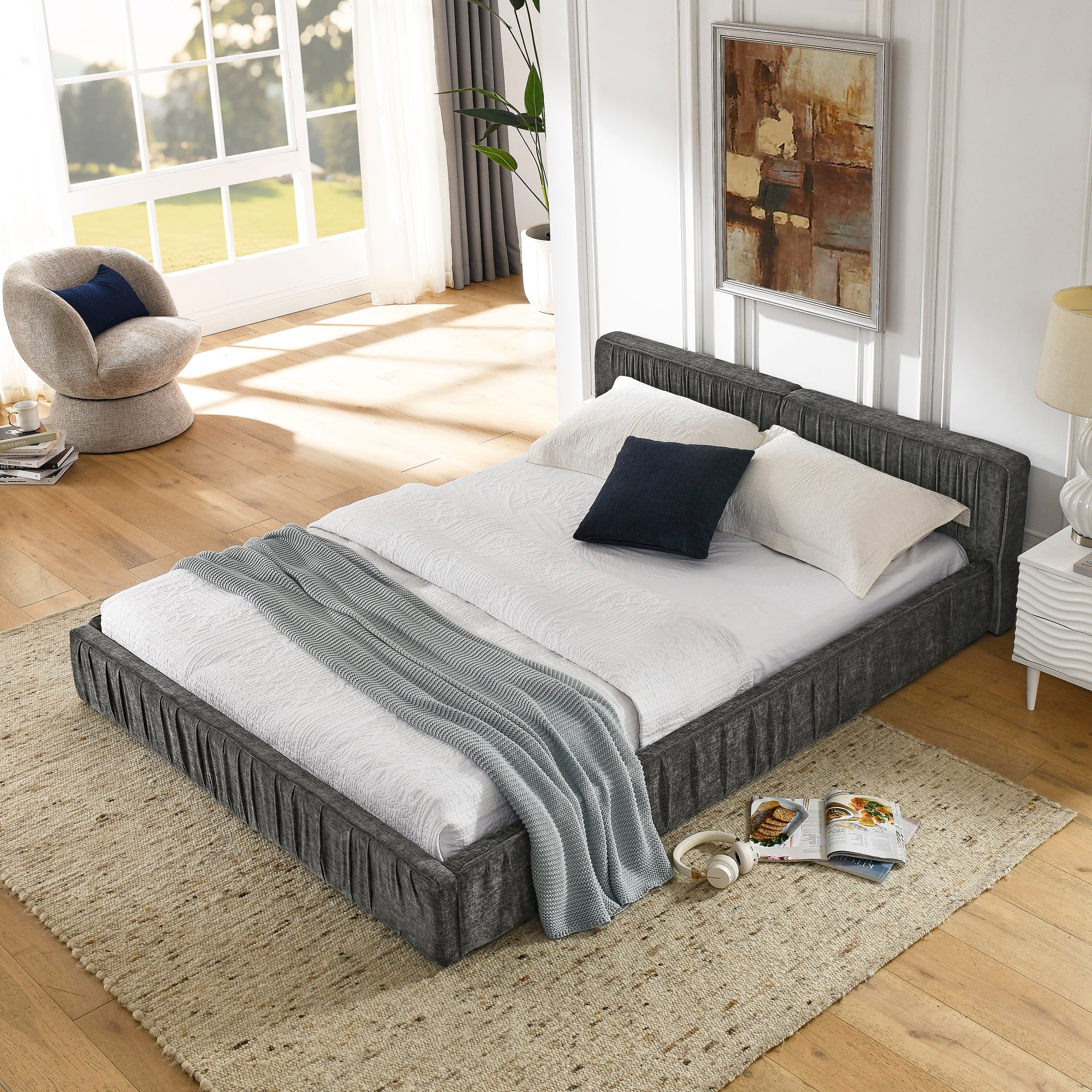 The large grey padded bed frame is designed with Chenille fabric