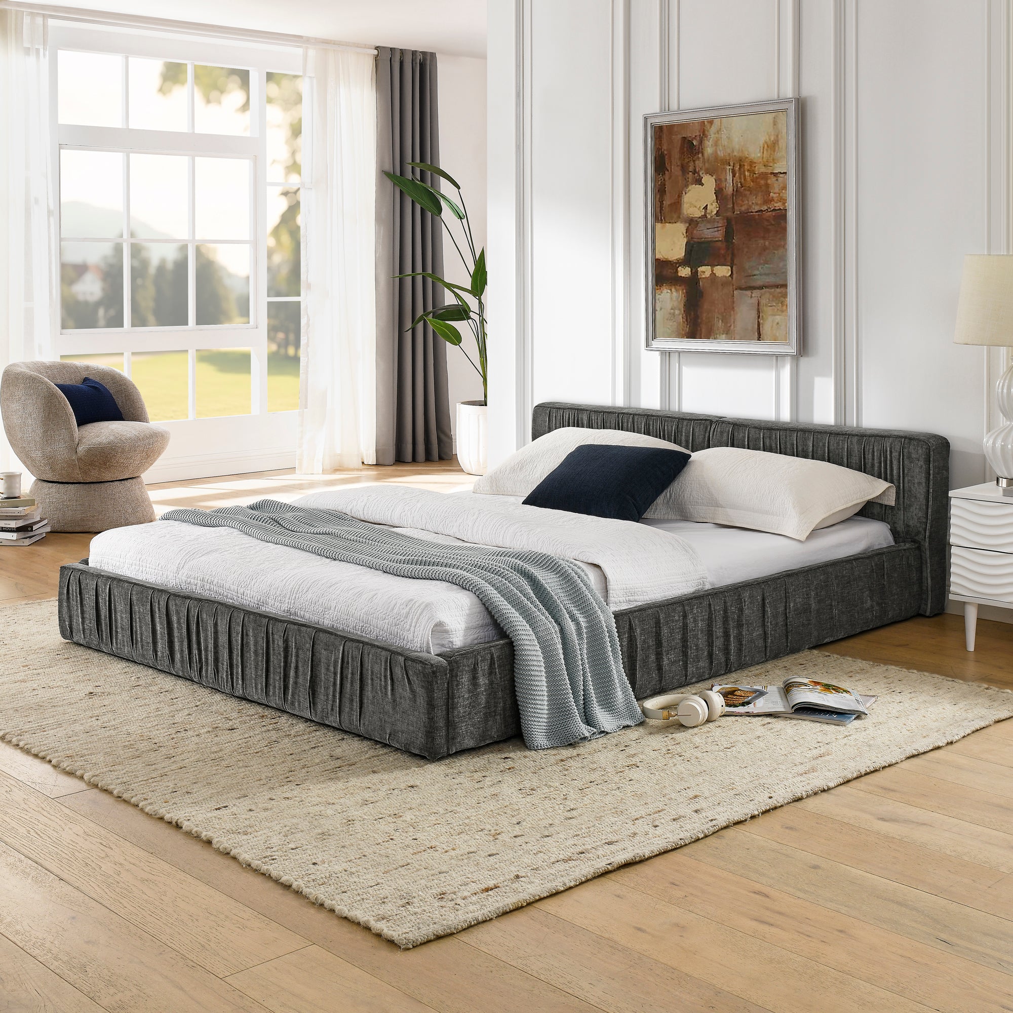 The large grey padded bed frame is designed with Chenille fabric