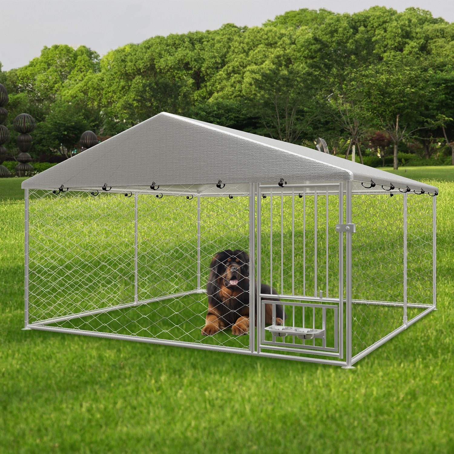 Large outdoor fenced kennel with a rotating feeder